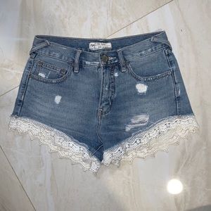 Free people jean shorts with lace detail